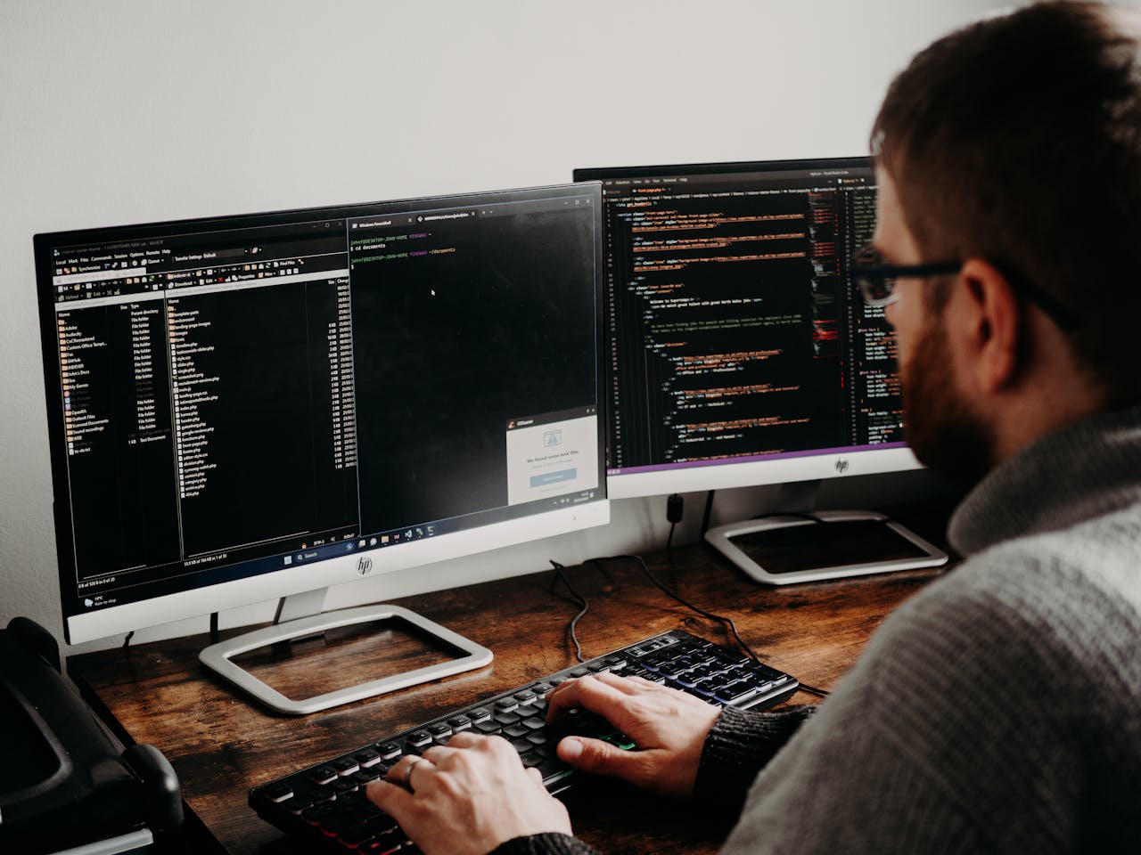 Man working at desk doing web development